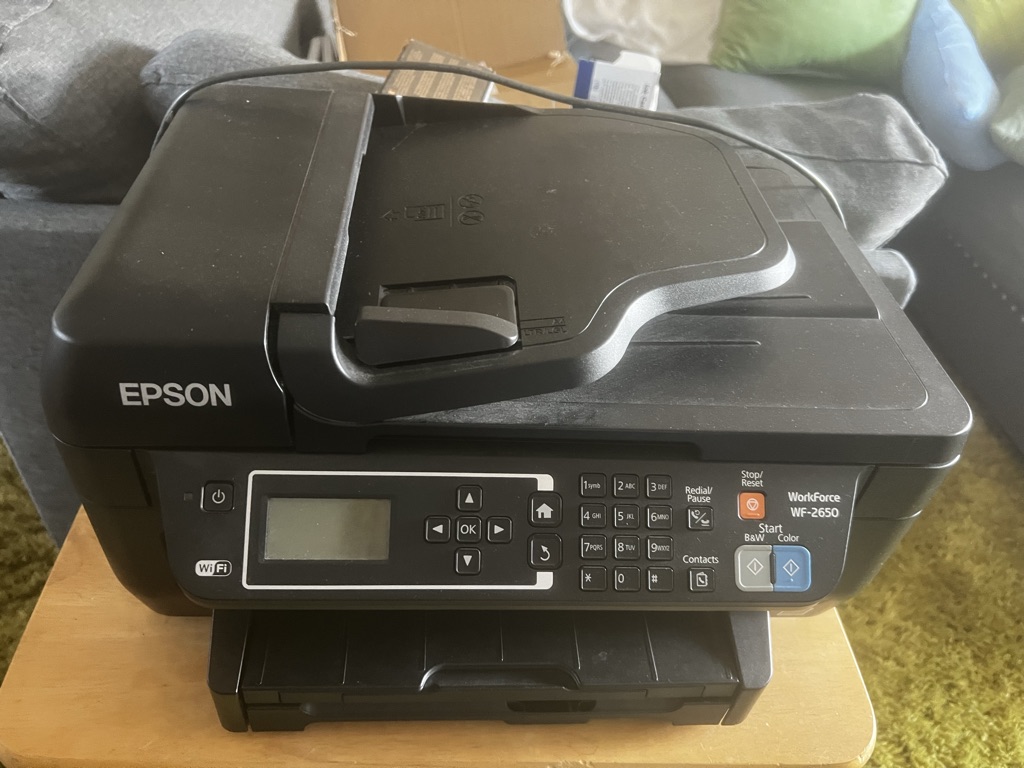 Free Epson workforce all in one printer with multiple black and color ink cartridges
