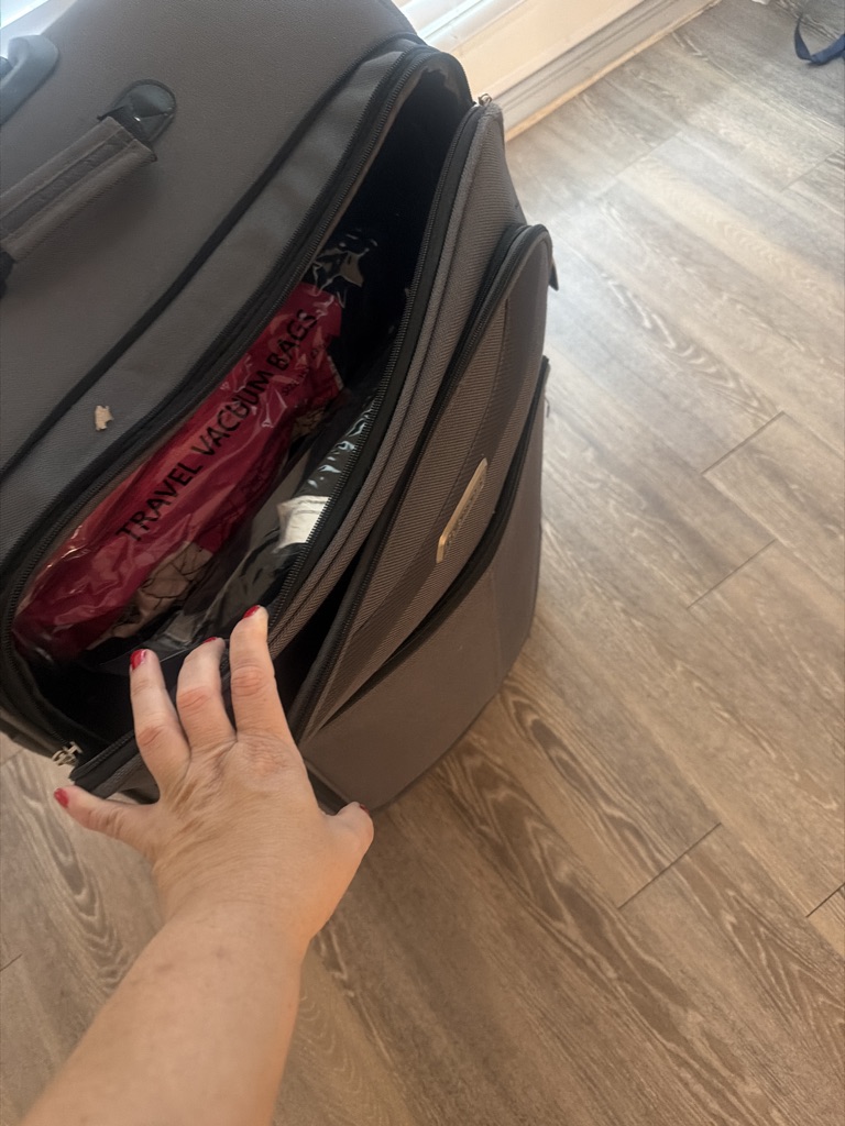 Free A suitcase with used clothes and used shoes
