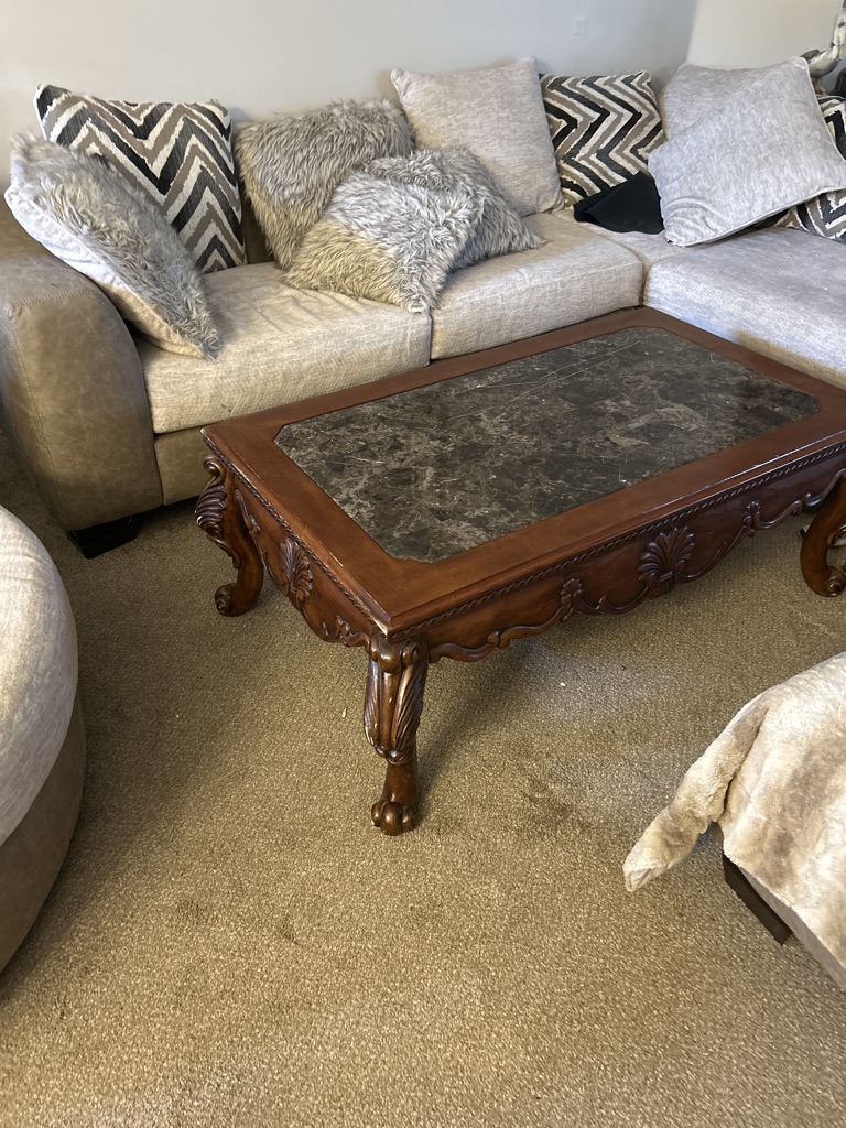 Free hand carved wooden coffee table with granite top