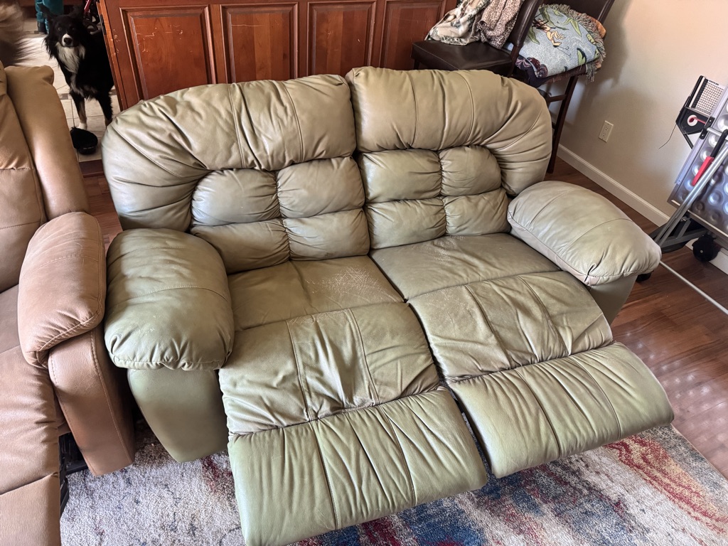 Free Leather reclining loveseat.