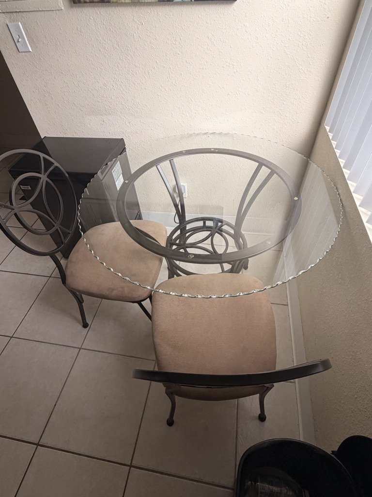 Free Glass top table and two chairs