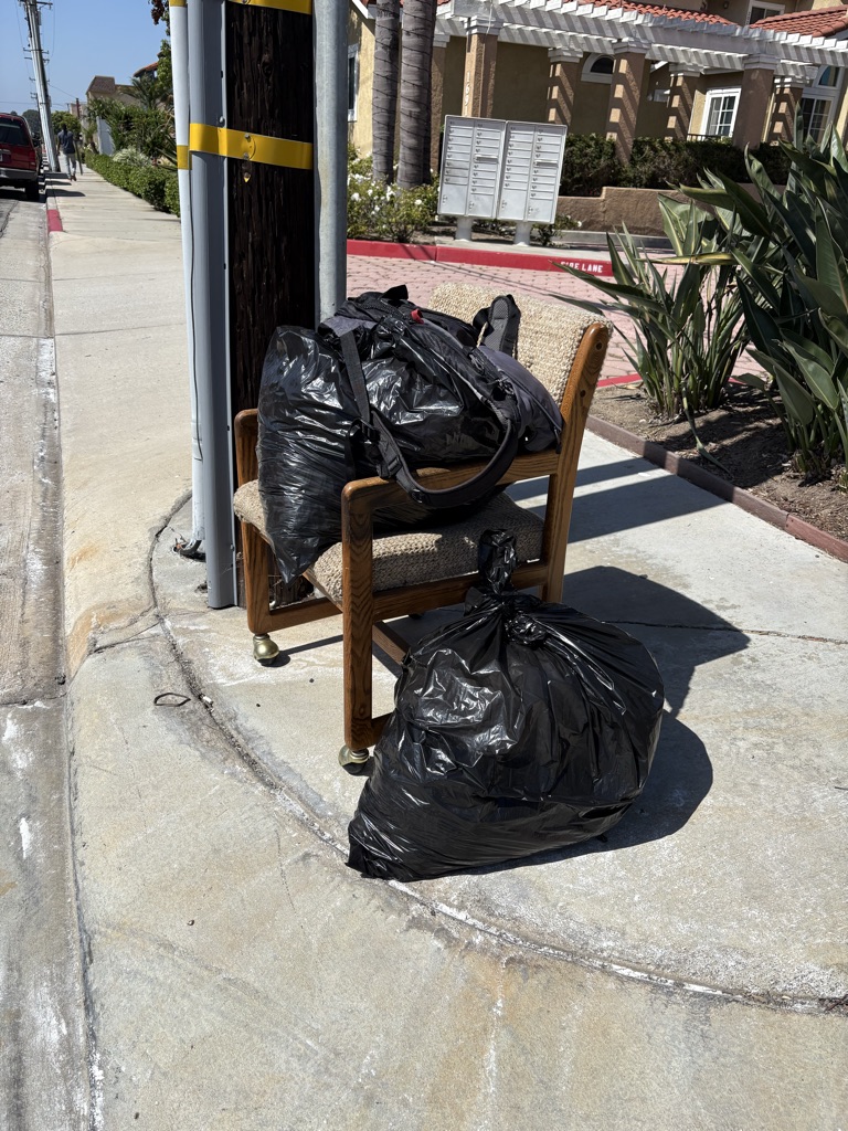 Free women’s clothes and shoes. Sitting on corner , just come pick up