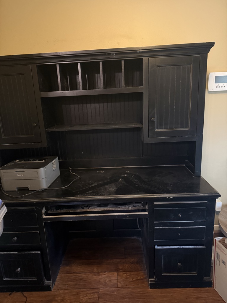 Free Black desk with top hutch.  Come apart